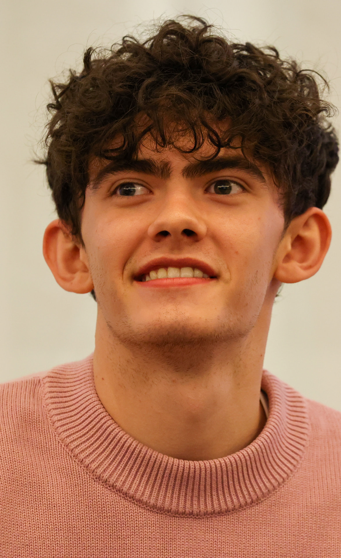 Joe Locke, star of Black Church Bay, smiling at a London convention in 2022